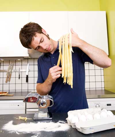 Man making homemade Fettuccine